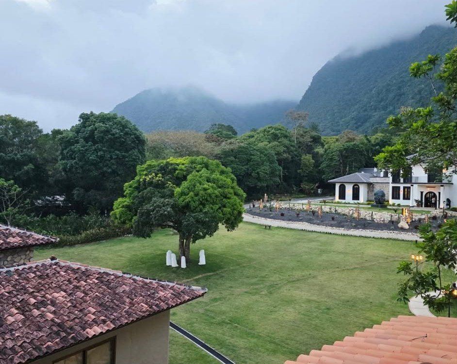 Misty mountains over the hotel lawn and gardens